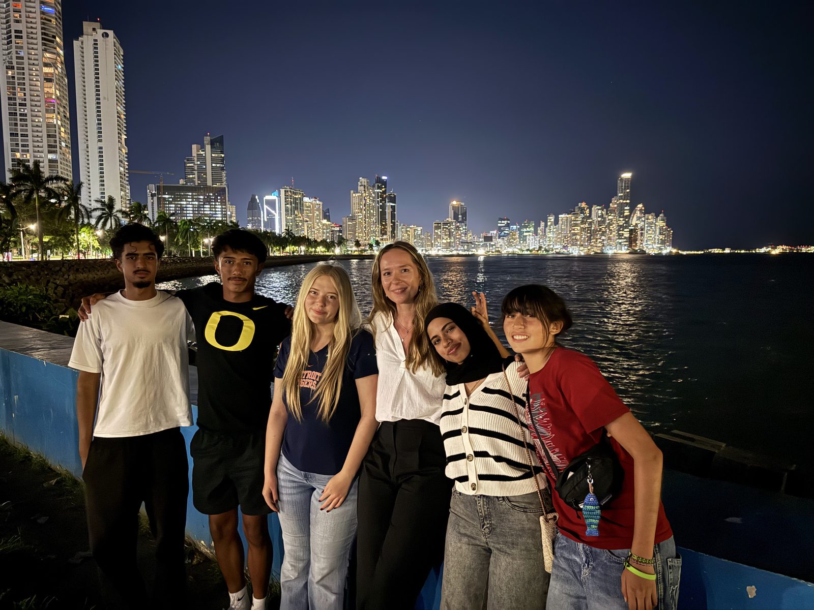 EnvironMentors students with the Panama City skyline at night